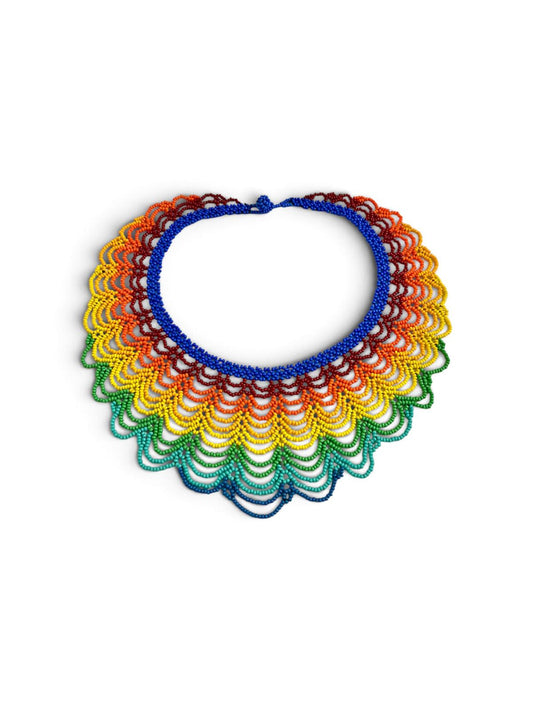 Rainbow Scalloped Beaded Collar with Royal Blue Neckband laid flat on white, handmade Colombian glass bead necklace by Zenú women