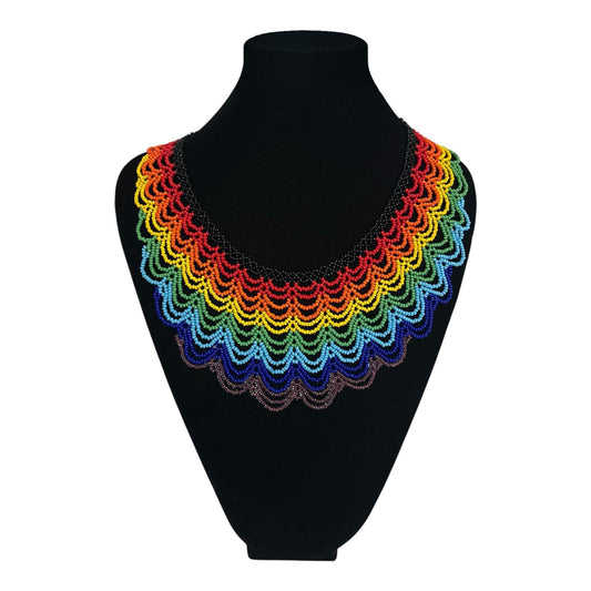 Rainbow Cascade Beaded Collar Necklace on velvet stand, handmade Colombian glass bead necklace by Zenú women