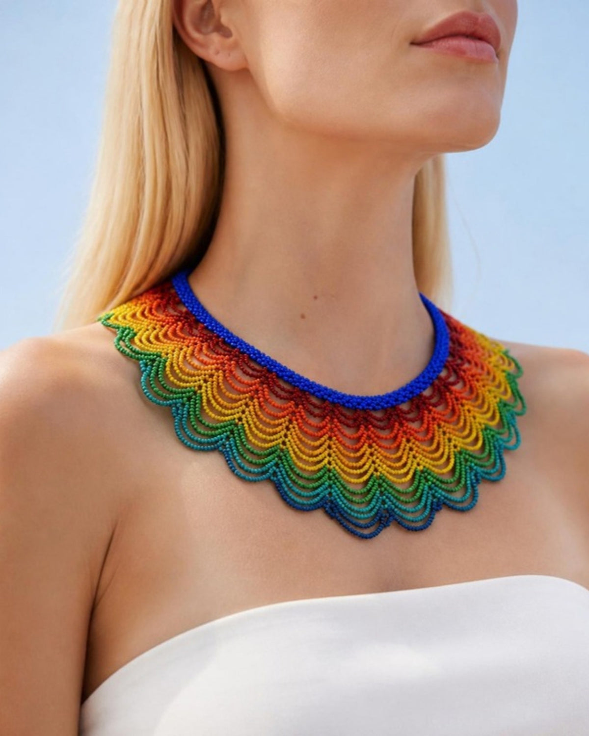 Model wearing Rainbow Scalloped Beaded Collar with Royal Blue Neckband, handmade Colombian glass bead necklace