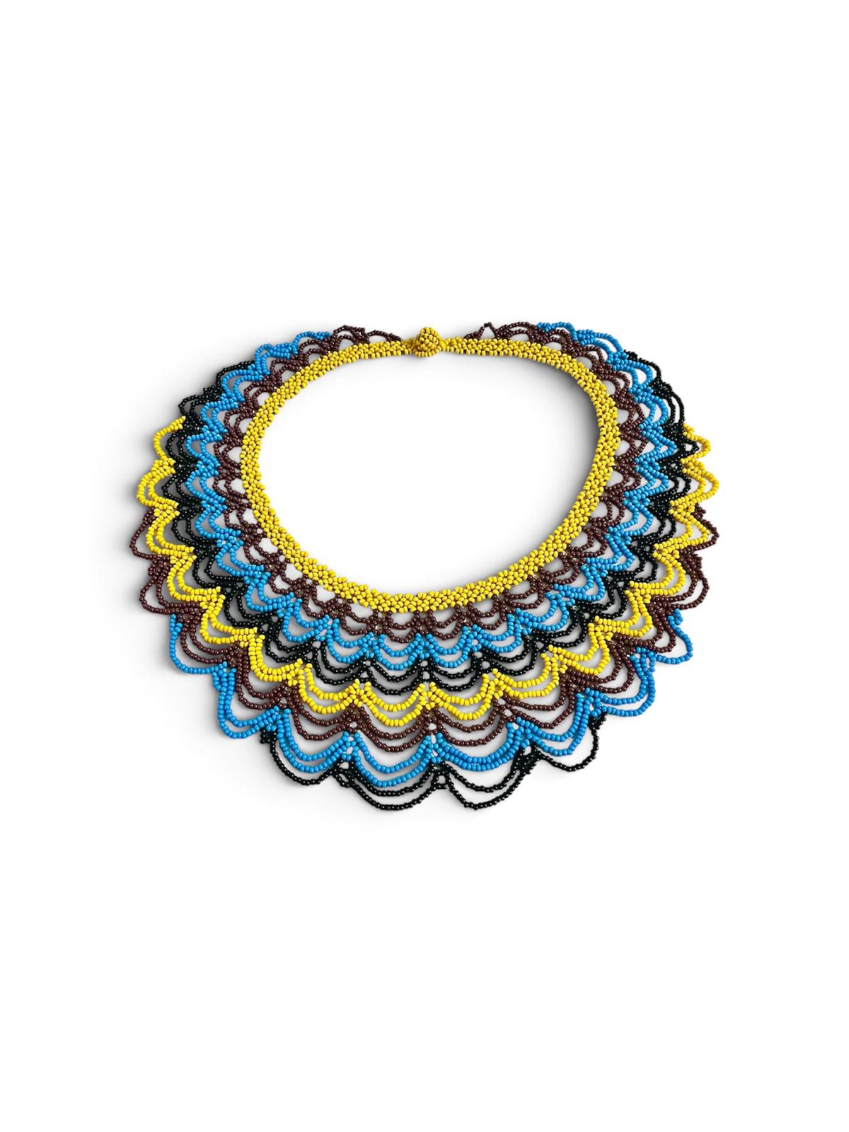 Yellow, Blue & Brown Layered Beaded Collar Necklace side view on white, handmade Colombian glass bead necklace by Zenú women