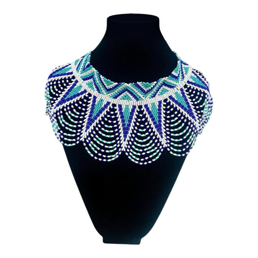 Turquoise Star Beaded Cape Collar Necklace on velvet stand, handmade Colombian glass bead necklace by Zenú women