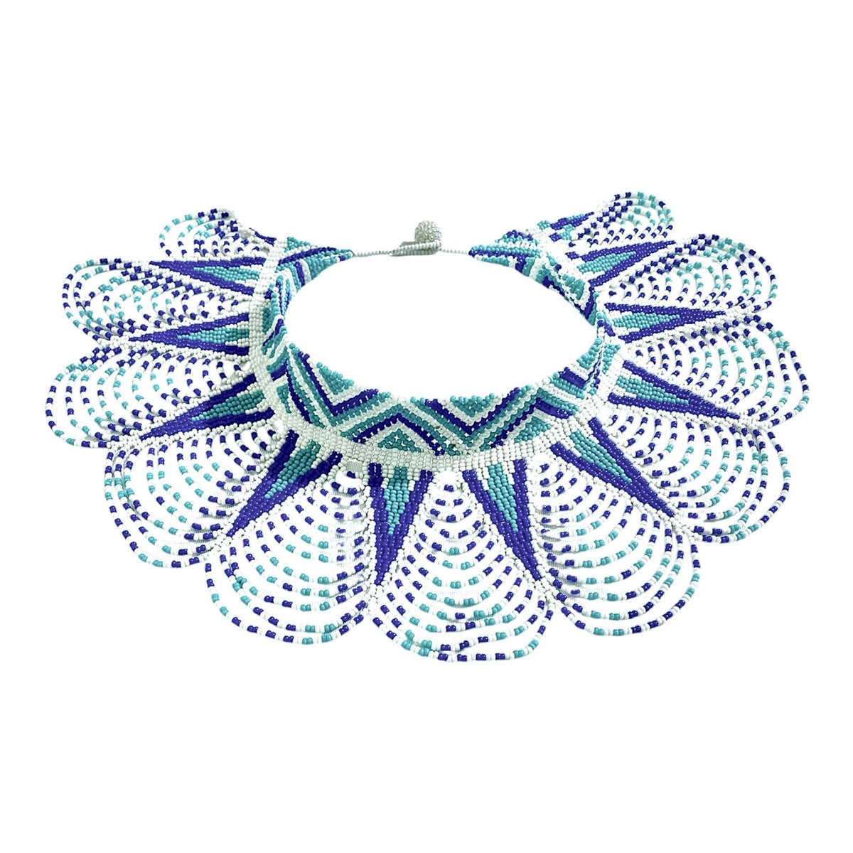 Turquoise Star Beaded Cape Collar Necklace laid flat on white, handmade Colombian glass bead necklace by Zenú women