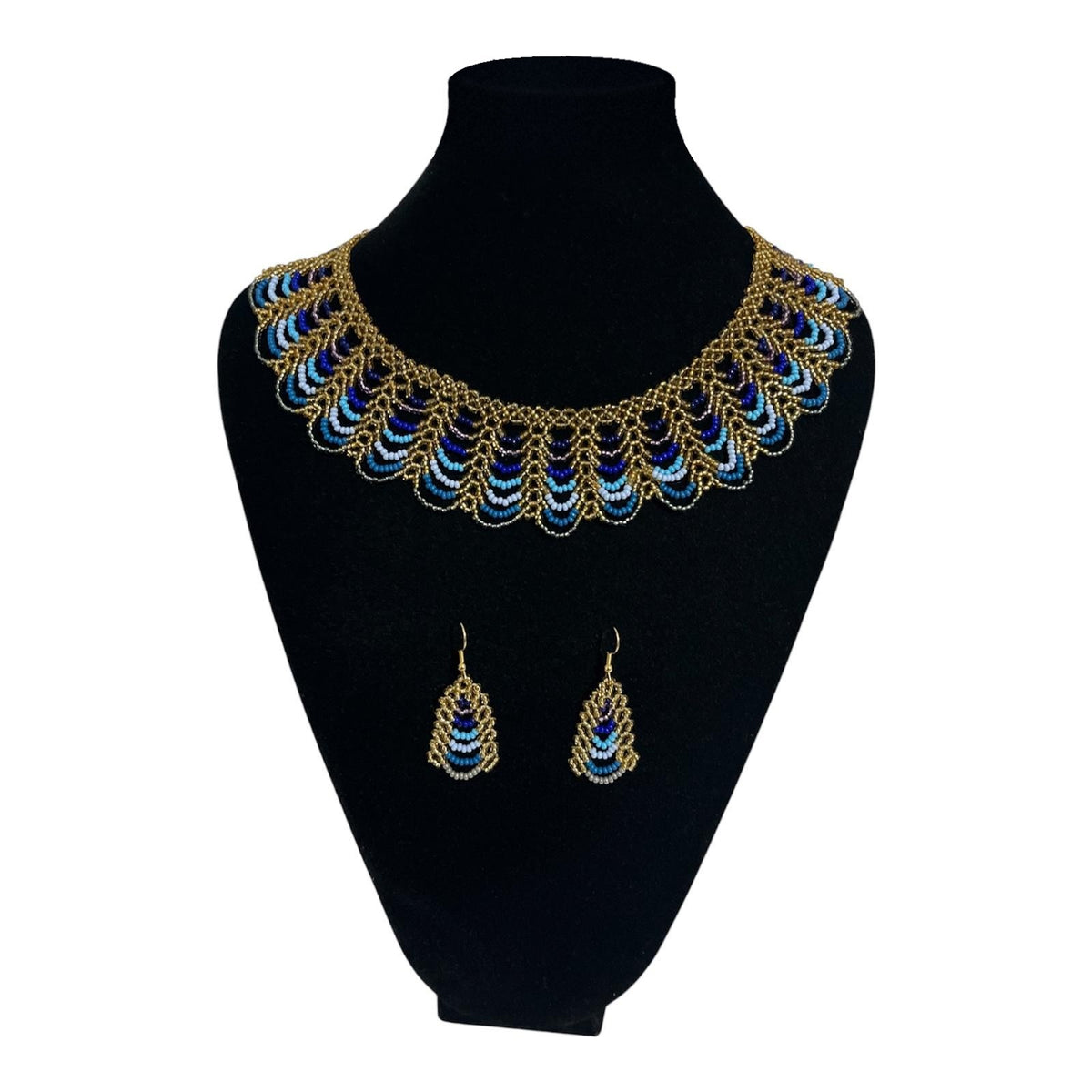 Peacock Blue & Gold Scalloped Beaded Collar Necklace on velvet stand with matching earrings, handmade Colombian glass bead necklace by Zenú women
