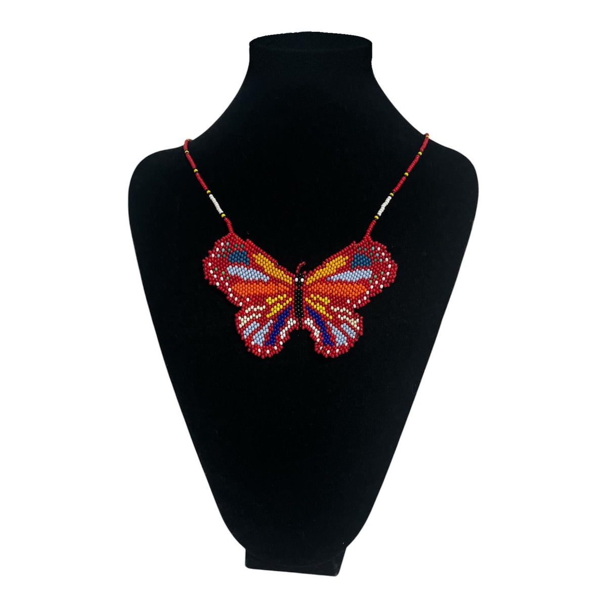 Red Butterfly Beaded Pendant Necklace on velvet stand, handmade Colombian glass bead necklace by Zenú women