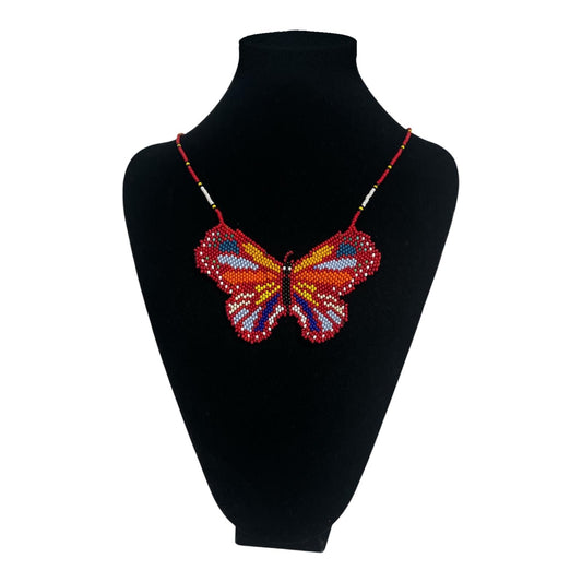 Red Butterfly Beaded Pendant Necklace on velvet stand, handmade Colombian glass bead necklace by Zenú women
