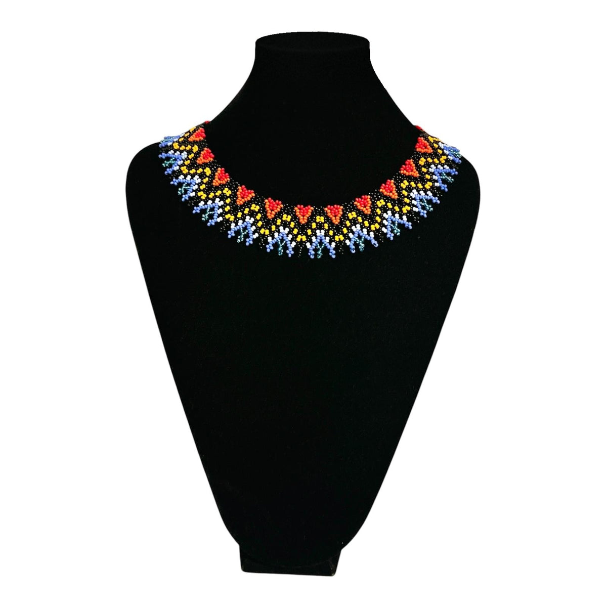 Red, Yellow & Blue Zigzag Beaded Choker Necklace on velvet stand, handmade Colombian glass bead necklace by Zenú women