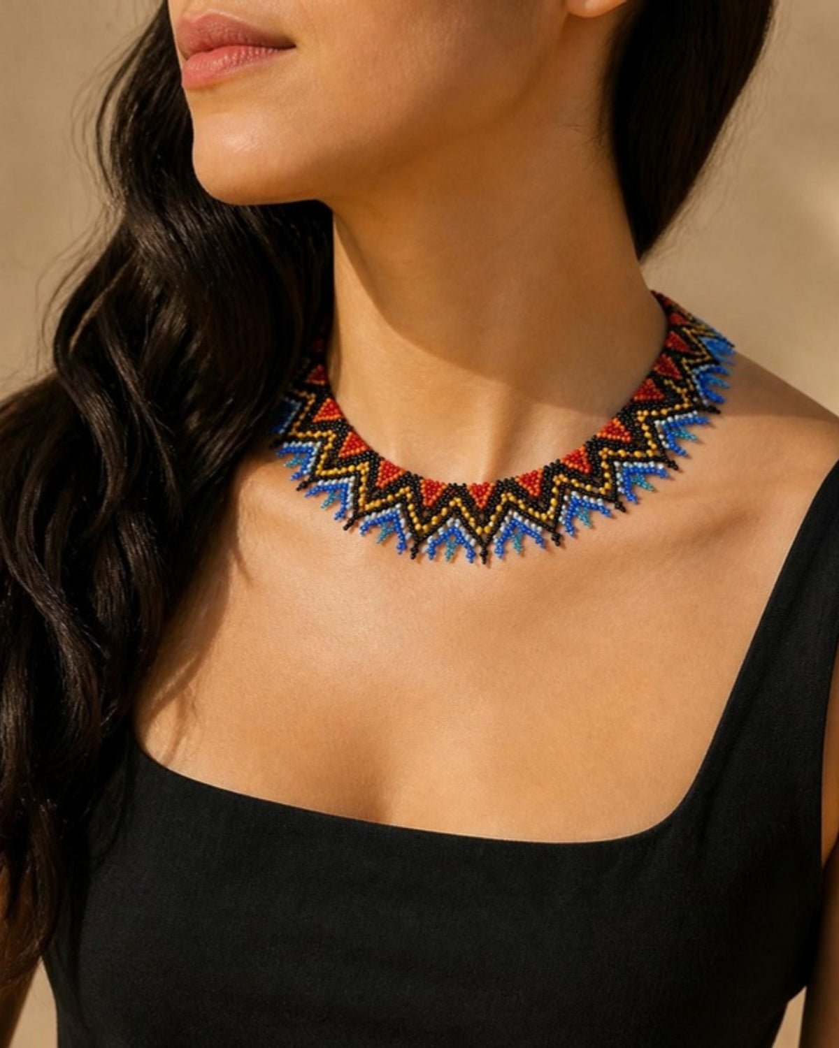 Model wearing Red, Yellow & Blue Zigzag Beaded Choker Necklace, handmade Colombian glass bead necklace
