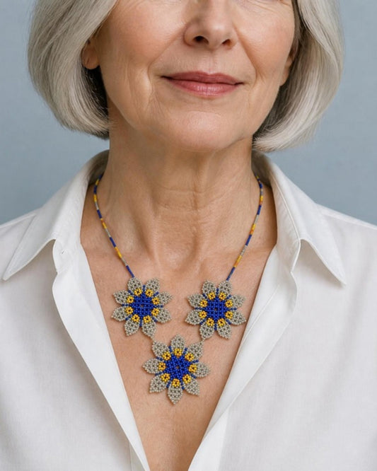 Model wearing Three Blue Flowers Beaded Pendant Necklace, handmade Colombian glass bead necklace