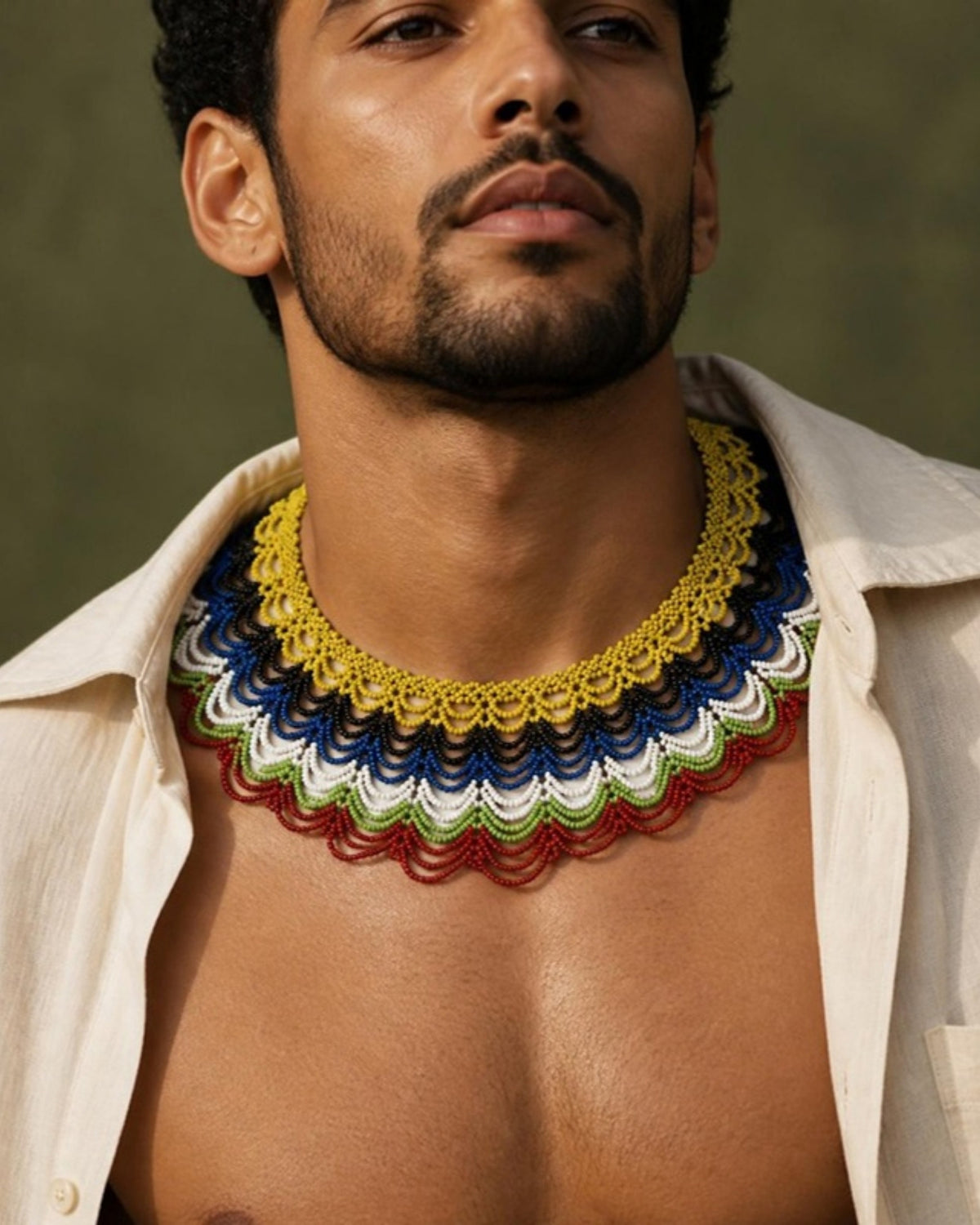 Male model wearing Navy, Red & Gold Layered Beaded Collar Necklace, handmade Colombian glass bead necklace