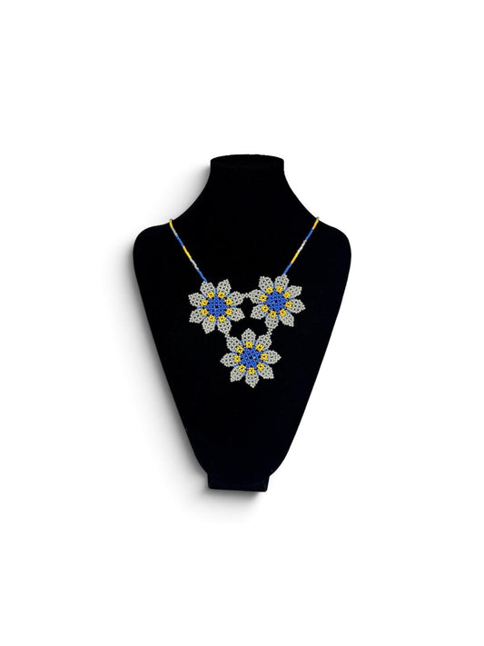 Three Blue Flowers Beaded Pendant Necklace on velvet stand, handmade Colombian glass bead necklace by Zenú women