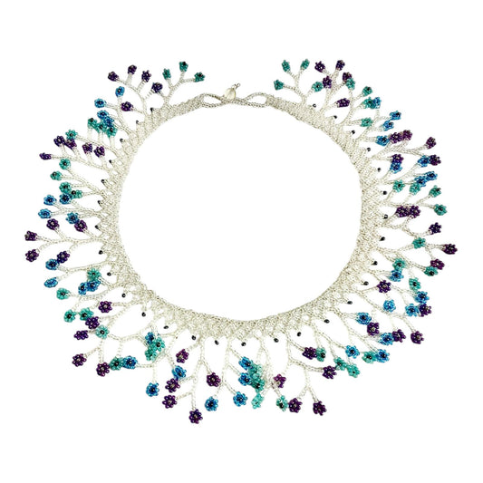 Silver & Teal Blossom Fringe Beaded Collar Necklace laid flat on white, handmade Colombian glass bead necklace by Zenú women