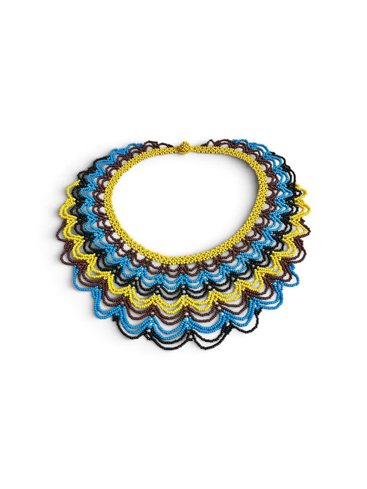 Yellow, Blue & Brown Layered Beaded Collar Necklace side view on white, handmade Colombian glass bead necklace by Zenú women